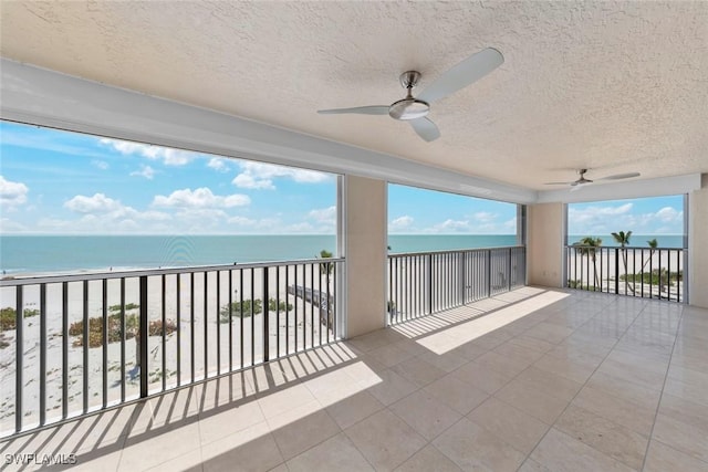 3127 W Gulf Dr Unit 106, Sanibel, FL 33957 - view of patio / terrace featuring a balcony, a water view, and ceiling fan