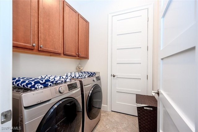 6561 Dominica Dr Unit 8-201, Naples, FL 34113 - laundry room with cabinet space and washing machine and clothes dryer