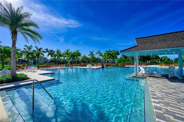 6561 Dominica Dr Unit 8-201, Naples, FL 34113 - community pool featuring a patio area