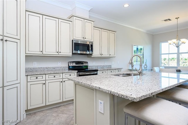 6561 Dominica Dr Unit 8-201, Naples, FL 34113 - kitchen featuring a breakfast bar area, a sink, visible vents, stainless steel appliances, and an inviting chandelier