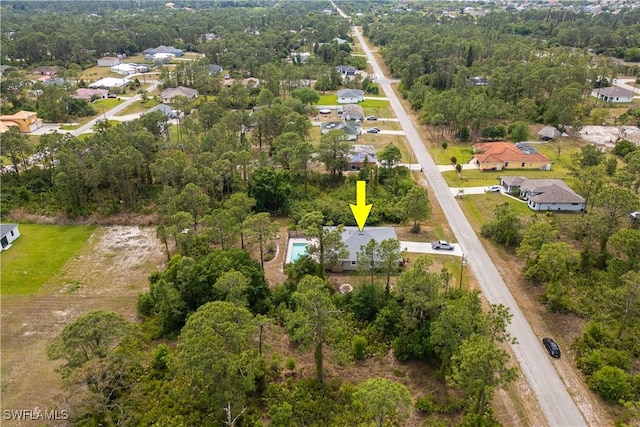 birds eye view of property with a residential view