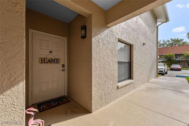 9623 Eaton Gardens Ln Unit 105, Fort Myers, FL 33919 - entrance to property with stucco siding