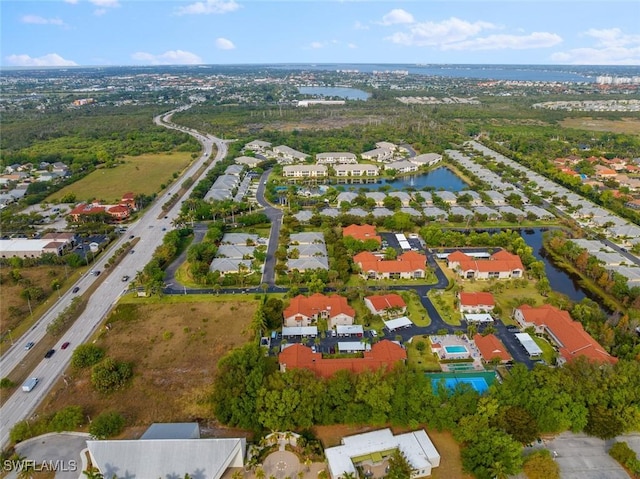 9623 Eaton Gardens Ln Unit 105, Fort Myers, FL 33919 - drone / aerial view featuring a water view and a residential view
