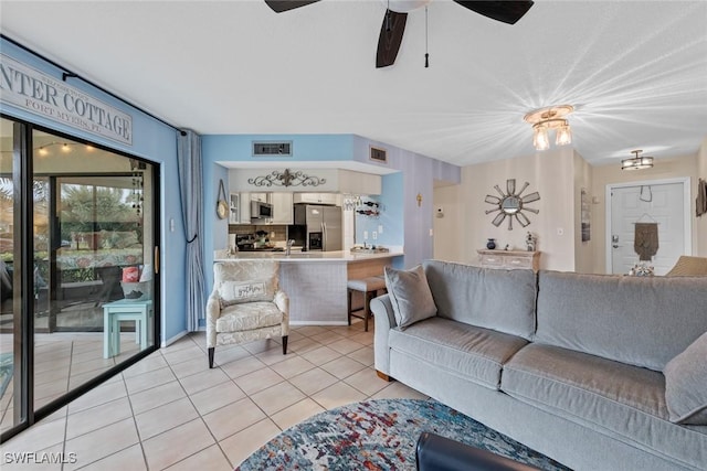 9623 Eaton Gardens Ln Unit 105, Fort Myers, FL 33919 - living area featuring a ceiling fan, light tile patterned flooring, and visible vents