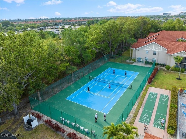 9623 Eaton Gardens Ln Unit 105, Fort Myers, FL 33919 - view of sport court with a lawn, fence, and shuffleboard