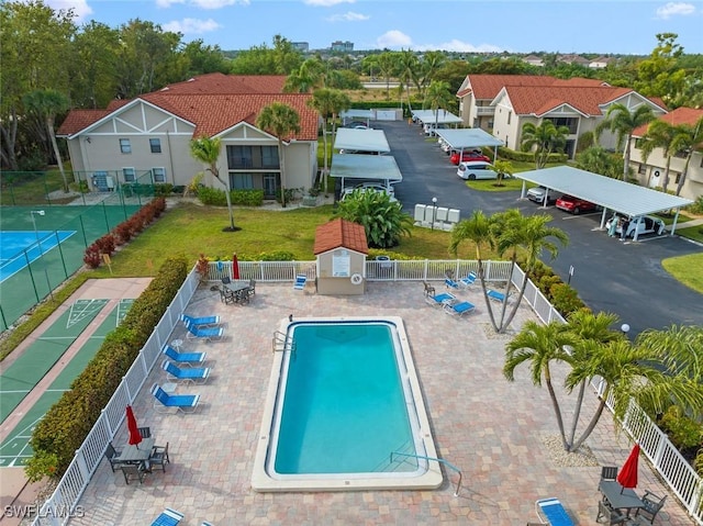 9623 Eaton Gardens Ln Unit 105, Fort Myers, FL 33919 - pool featuring a residential view, a yard, and fence