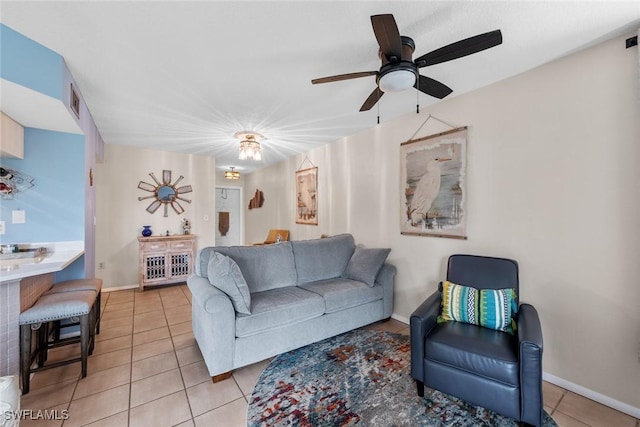 9623 Eaton Gardens Ln Unit 105, Fort Myers, FL 33919 - living area featuring baseboards, visible vents, a ceiling fan, and light tile patterned floors