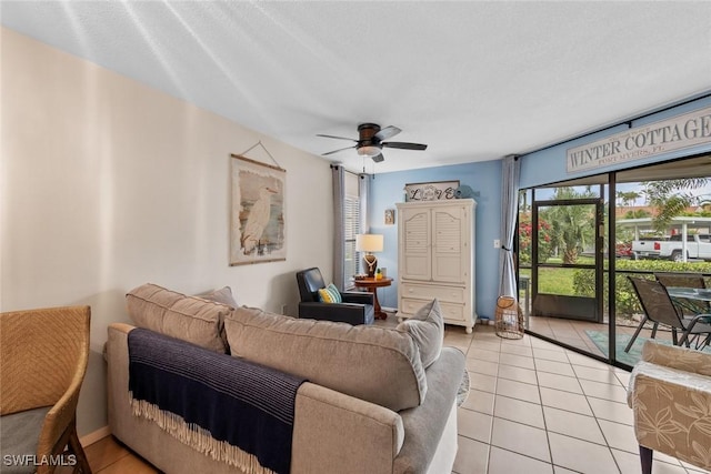 9623 Eaton Gardens Ln Unit 105, Fort Myers, FL 33919 - living area with a ceiling fan and light tile patterned floors