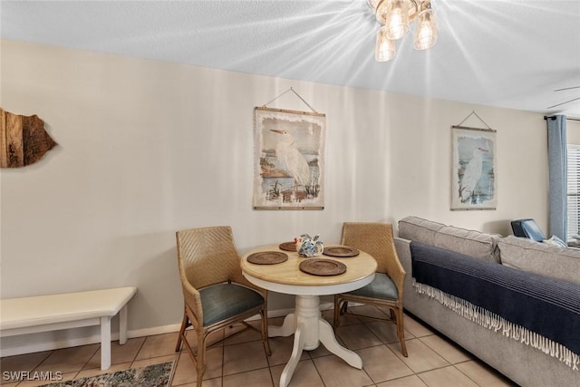 9623 Eaton Gardens Ln Unit 105, Fort Myers, FL 33919 - tiled dining room featuring baseboards