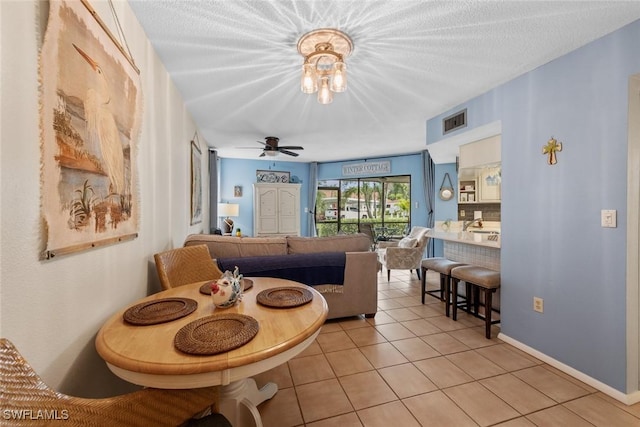 9623 Eaton Gardens Ln Unit 105, Fort Myers, FL 33919 - living room with light tile patterned flooring, baseboards, and visible vents