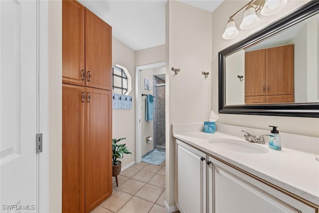 9623 Eaton Gardens Ln Unit 105, Fort Myers, FL 33919 - full bathroom with a stall shower, tile patterned flooring, and vanity