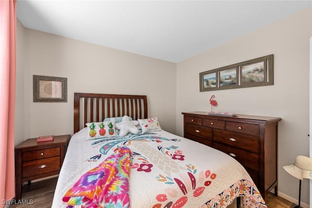 9623 Eaton Gardens Ln Unit 105, Fort Myers, FL 33919 - bedroom featuring wood finished floors