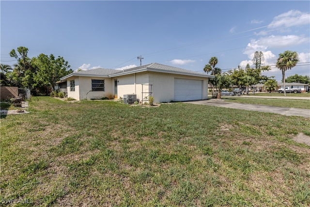 4646 Palm Tree Blvd, Cape Coral, FL 33904 - view of front of property with driveway, an attached garage, a front yard, and stucco siding