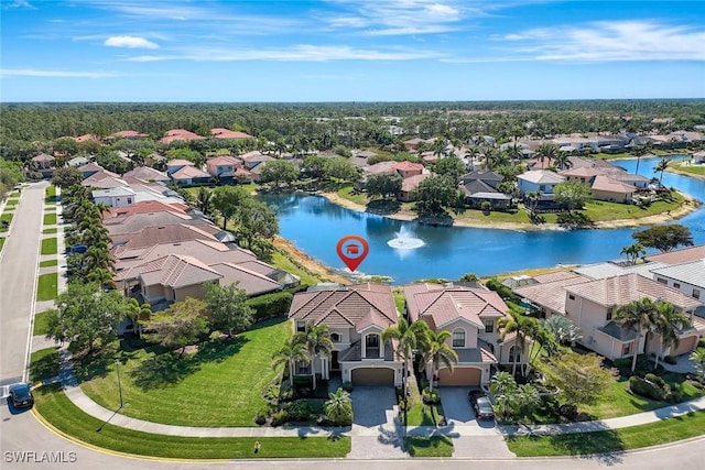aerial view of residential area with a large body of water