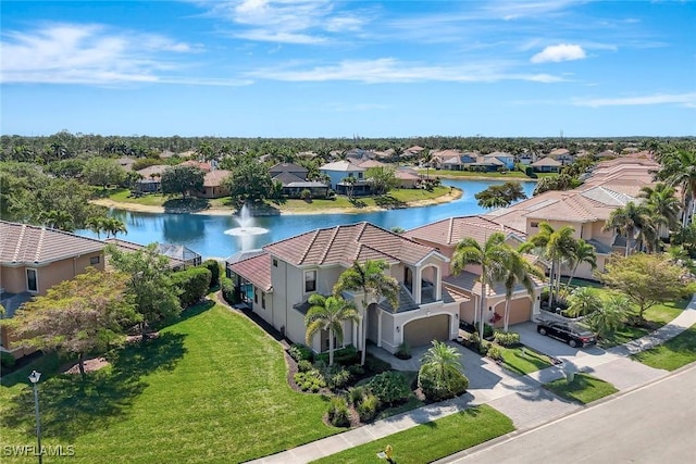 aerial perspective of suburban area featuring a nearby body of water