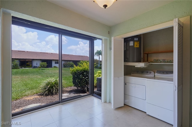 16860 Ginger Ln Unit 3049, Fort Myers, FL 33908 - washroom featuring washer and clothes dryer and light tile patterned floors