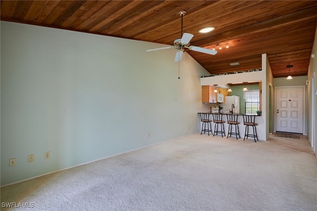 16860 Ginger Ln Unit 3049, Fort Myers, FL 33908 - living room featuring wood ceiling, light colored carpet, a ceiling fan, baseboards, and lofted ceiling