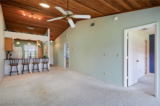 16860 Ginger Ln Unit 3049, Fort Myers, FL 33908 - unfurnished living room with wooden ceiling, light carpet, ceiling fan, vaulted ceiling, and a sink
