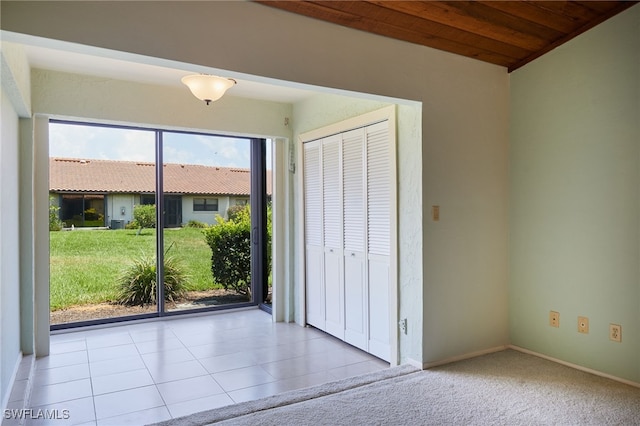 16860 Ginger Ln Unit 3049, Fort Myers, FL 33908 - unfurnished bedroom with access to exterior, a closet, baseboards, and tile patterned flooring