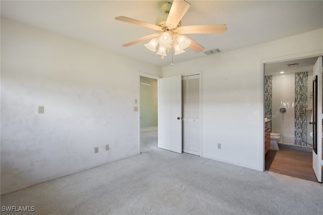 16860 Ginger Ln Unit 3049, Fort Myers, FL 33908 - unfurnished bedroom with carpet flooring, a closet, ensuite bathroom, and ceiling fan