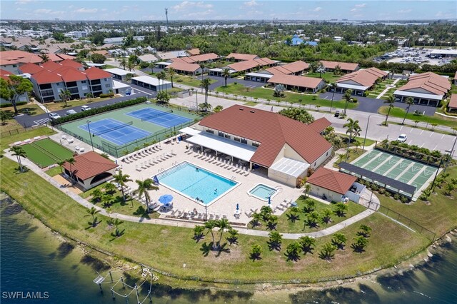 16860 Ginger Ln Unit 3049, Fort Myers, FL 33908 - drone / aerial view of a pool and a nearby body of water