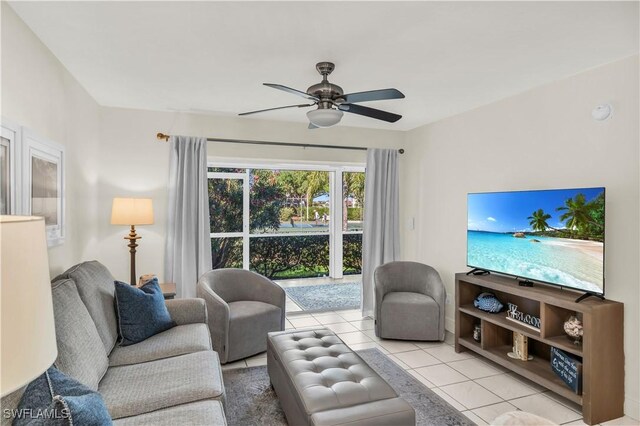 661 W Elkcam Cir Unit 911, Marco Island, FL 34145 - living area with light tile patterned floors and ceiling fan