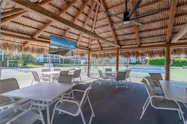 661 W Elkcam Cir Unit 911, Marco Island, FL 34145 - view of patio / terrace featuring a gazebo, ceiling fan, and outdoor dining space