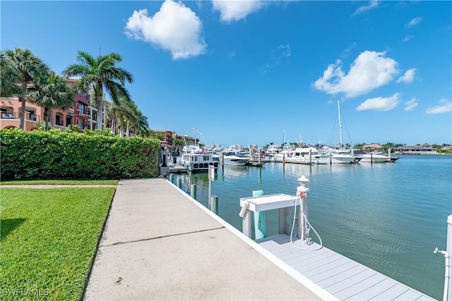 661 W Elkcam Cir Unit 911, Marco Island, FL 34145 - dock area with a water view, a lawn, and view of marina