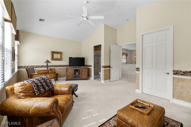 living area featuring visible vents, a ceiling fan, light carpet, baseboards, and high vaulted ceiling