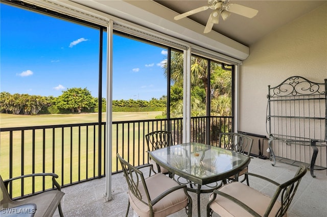 sunroom / solarium featuring view of golf course