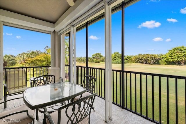 sunroom with view of golf course