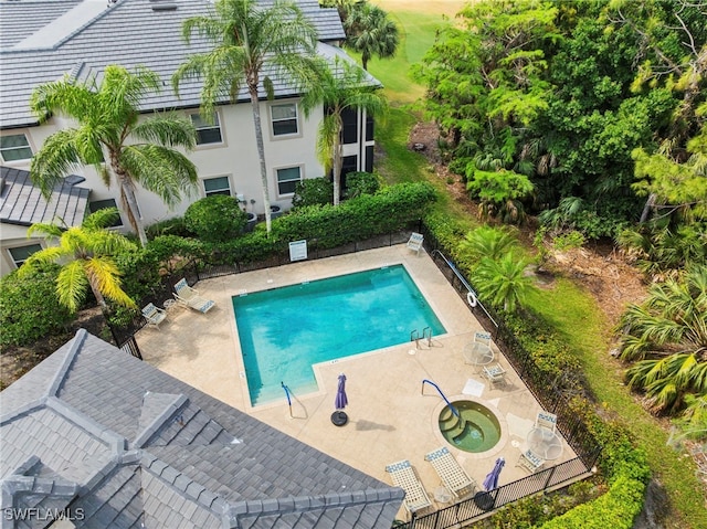 community pool featuring a patio area