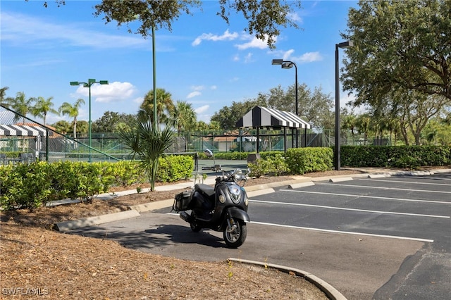 uncovered parking lot with fence