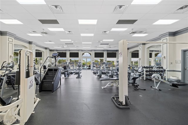 workout area with a drop ceiling and visible vents