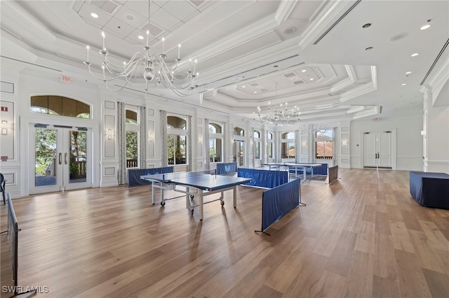 game room with a healthy amount of sunlight, french doors, and a chandelier