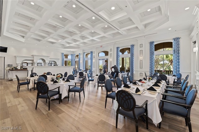 dining area with recessed lighting, light wood finished floors, coffered ceiling, ornamental molding, and beam ceiling