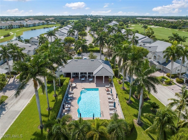 birds eye view of property featuring view of golf course, a water view, and a residential view