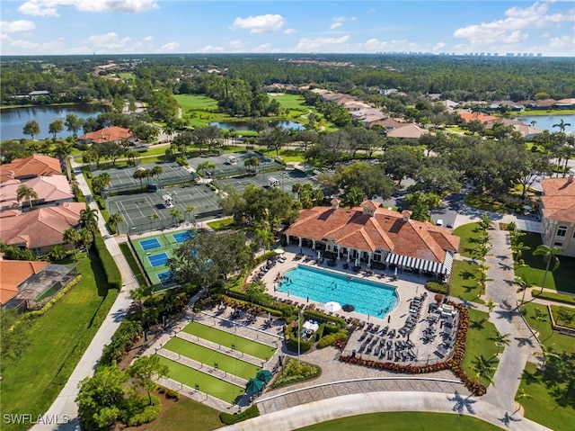drone / aerial view with a water view and a residential view