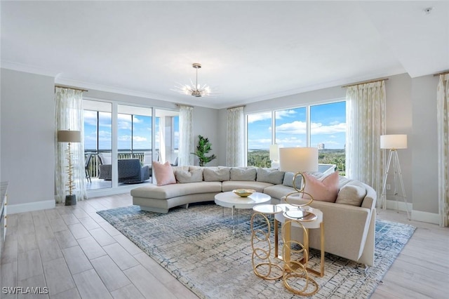 4971 Bonita Bay Blvd Unit 606, Bonita Springs, FL 34134 - living area with ornamental molding, light wood-style flooring, a notable chandelier, and baseboards