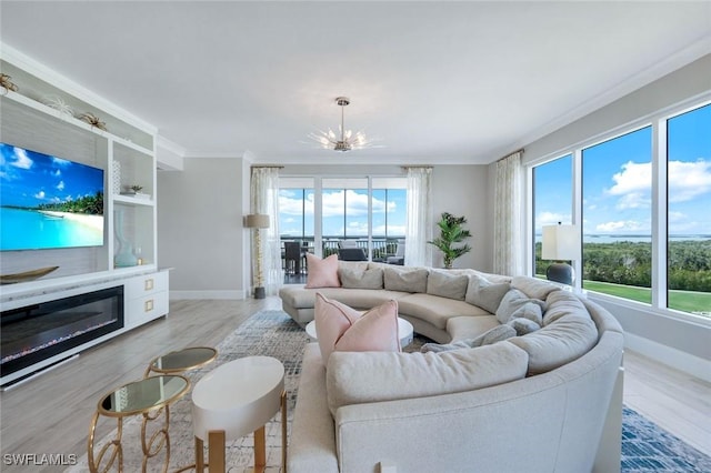 4971 Bonita Bay Blvd Unit 606, Bonita Springs, FL 34134 - living area featuring a wealth of natural light, a notable chandelier, and ornamental molding
