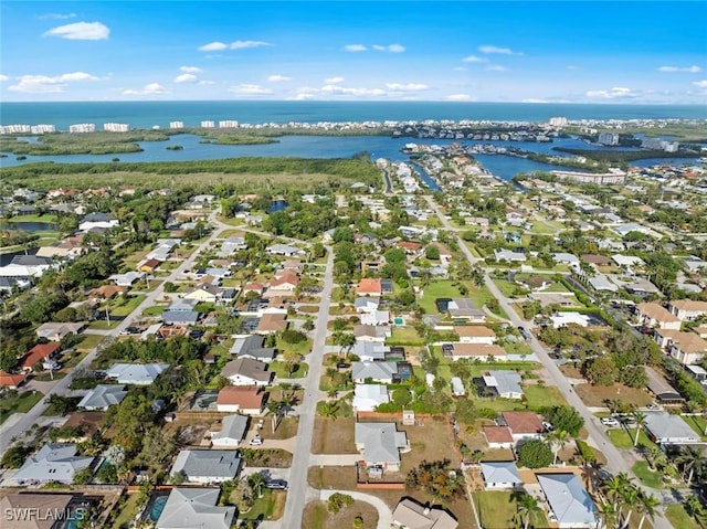 birds eye view of property featuring a water view and a residential view