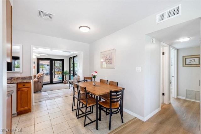 dining area with visible vents, baseboards, and light tile patterned flooring