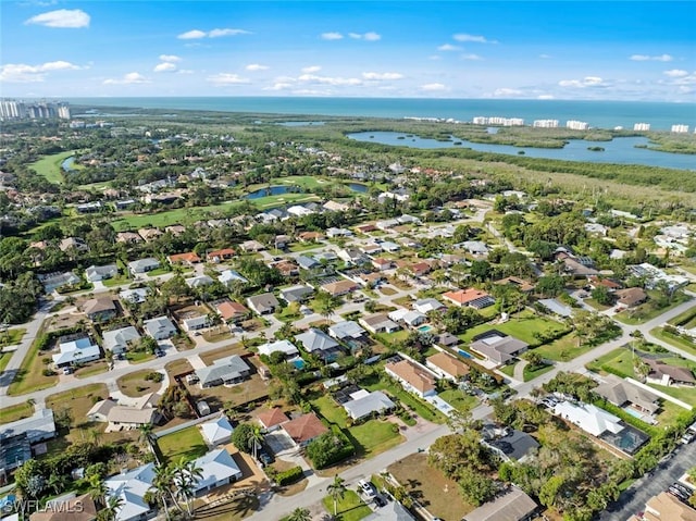 drone / aerial view with a water view and a residential view