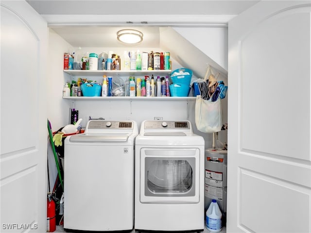 21687/689 Indian Bayou Dr, Fort Myers Beach, FL 33931 - laundry room featuring washing machine and clothes dryer and water heater