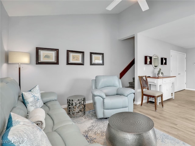 21687/689 Indian Bayou Dr, Fort Myers Beach, FL 33931 - living area with light wood-style floors, ceiling fan, stairs, baseboards, and vaulted ceiling