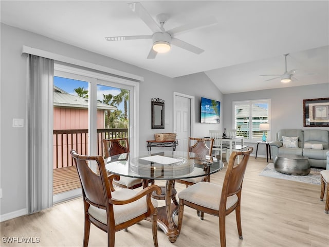 21687/689 Indian Bayou Dr, Fort Myers Beach, FL 33931 - dining space featuring a ceiling fan, light wood-type flooring, vaulted ceiling, and baseboards