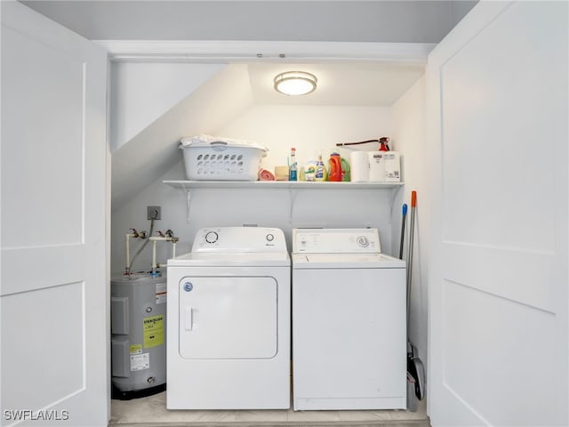 21687/689 Indian Bayou Dr, Fort Myers Beach, FL 33931 - laundry area featuring electric water heater and separate washer and dryer