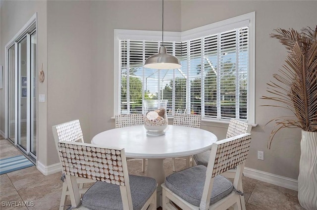 tiled dining area with baseboards