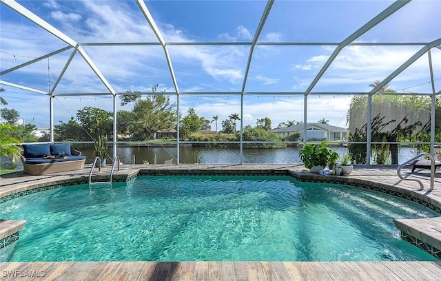 outdoor pool with a water view, a lanai, and a patio area