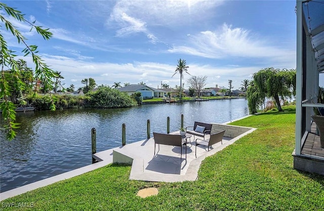 view of dock with a water view and a yard